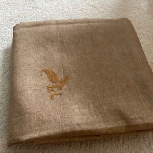 Beautiful beige color paper silk saree with coral color blouse with long sleeve.